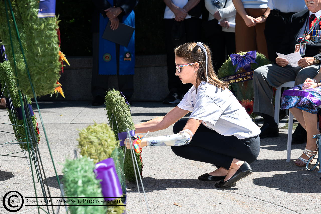 Image: Megan Mantha laying a wreath on behalf of the War 
					Amps