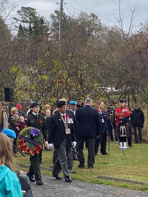 Image: Persons in the photo are: Major (Ret`d) John H. Russell, OMM, 
				CD, (O St G /USA) -  Son of Albert J. Russell, RRC, 
				Master Corporal Colten Bombara from the Princess of Wales` Own 
				(PWOR) Cadet Corps, acting as the escort. Photo courtesy of Colten’s mother Chantal Gaudreau