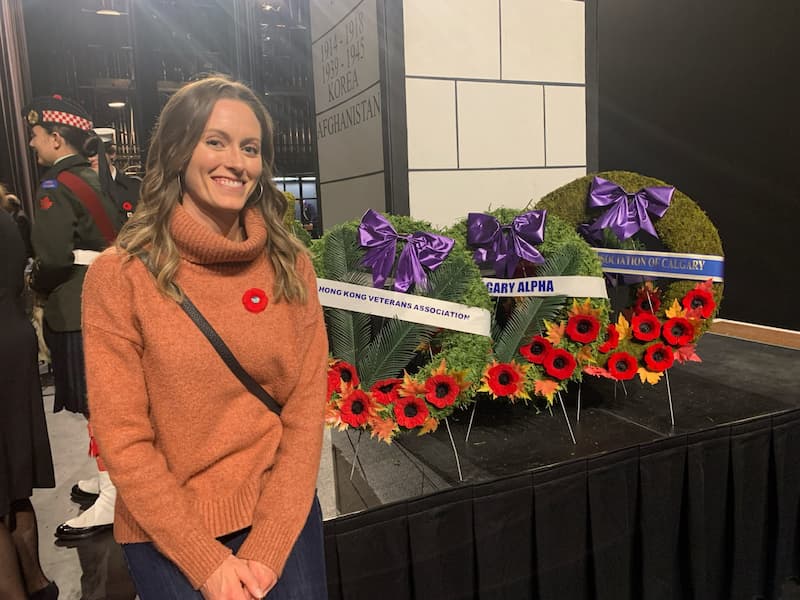 Image:Christine Plett who laid a 
				wreath with her son Jake Plett. They are the Granddaughter and 
				Great Grandson of Ralph Maclean. (Photo by Norma Fuchs. Used by permission).