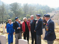 Sai Wan Cemetery, L to R: Betty Waldenberger, Aubrey Flegg, Albina Guarnieri, Mrs. Martin, Prime Minister Martin, Larry Stebbe, John Lowe